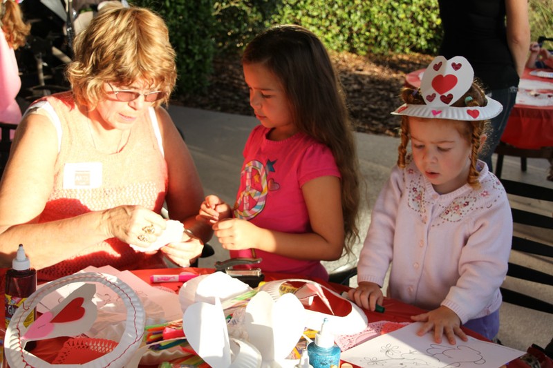 Liz Estes Helping Children to make Valentines Crafts at the Creativity Extravaganza!